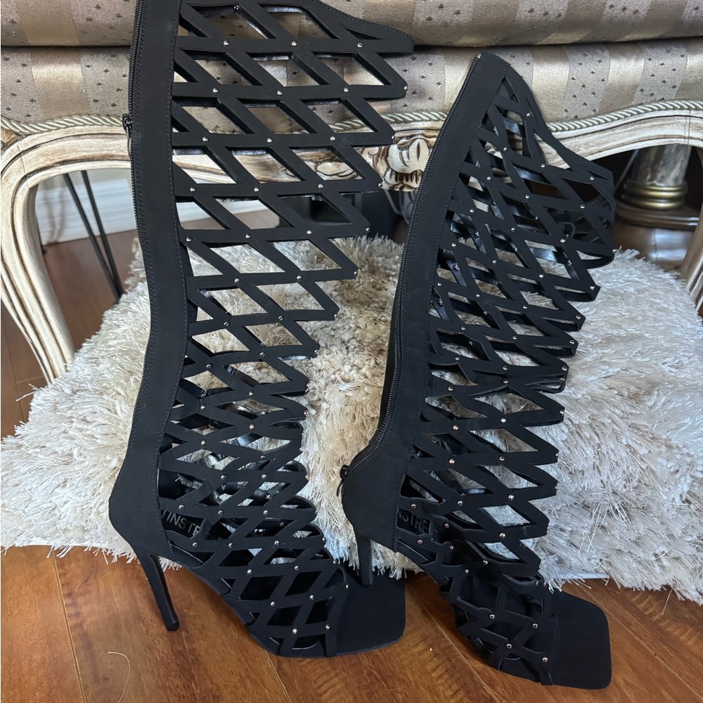 Beautiful black knee high summer sandal .